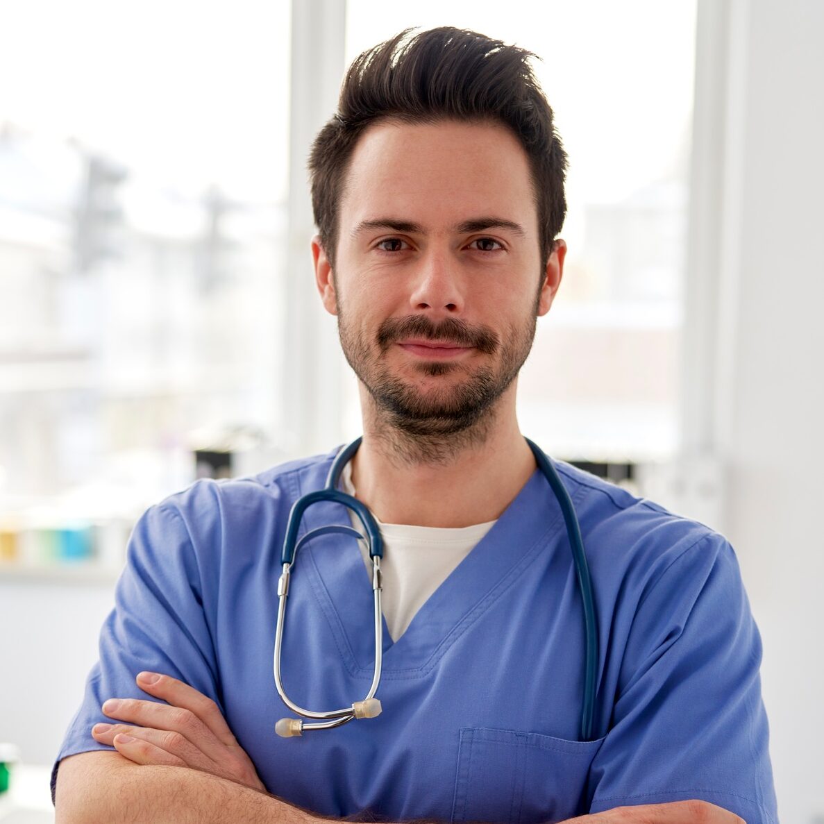 Portrait of young smiling doctor in the doctor's office